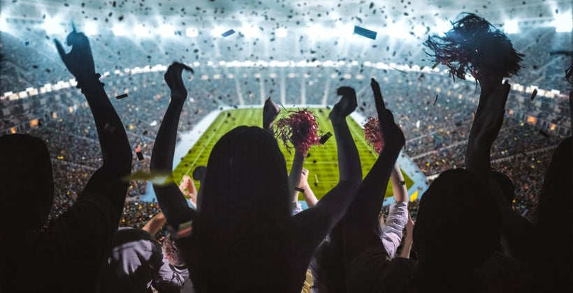 What are the advantages of using LED flood lights at sports venues?