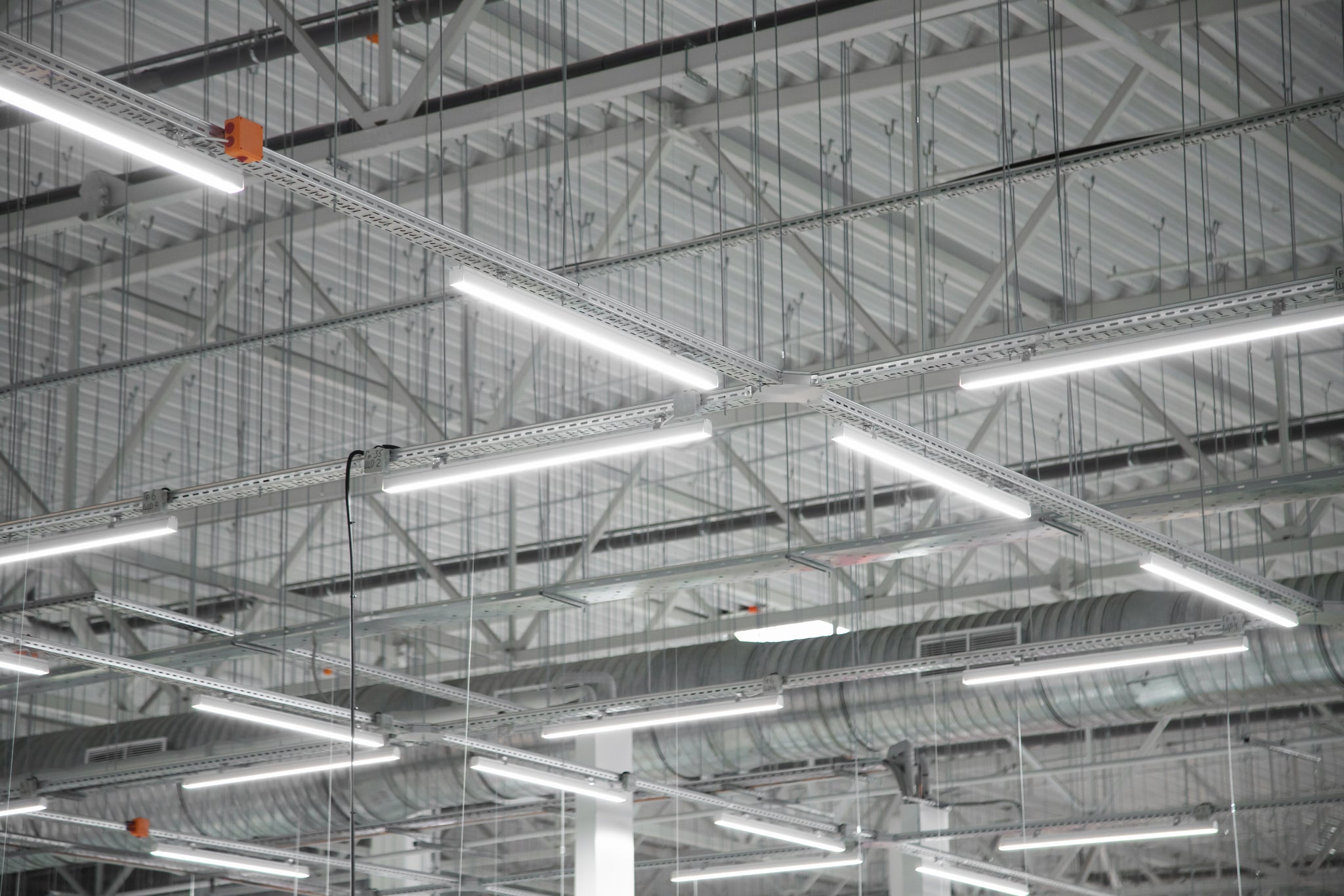 An image of led industrial lighting in a warehouses.