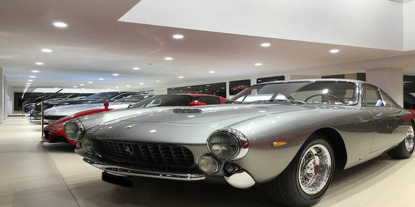 Silver Ferrari sports car in a showroom